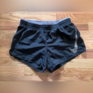 Black Nike shorts. Size XS. Side slit. Practically new!